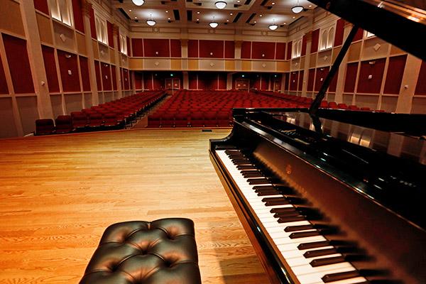 Featured image of a concert piano up on stage