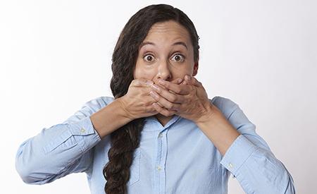stock photo woman covers mouth